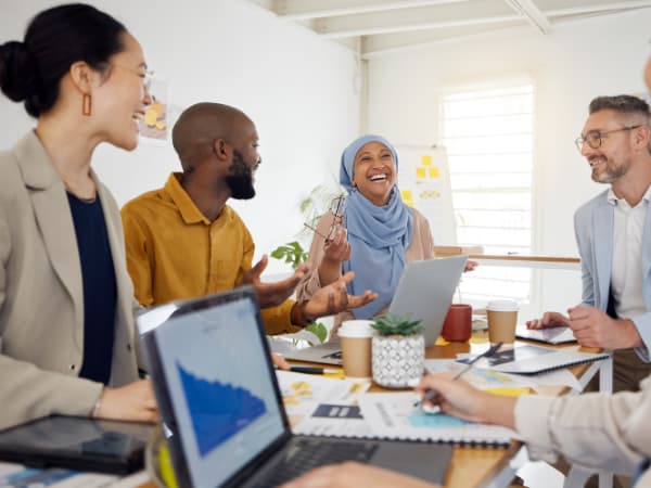 People at a table discussing HR data